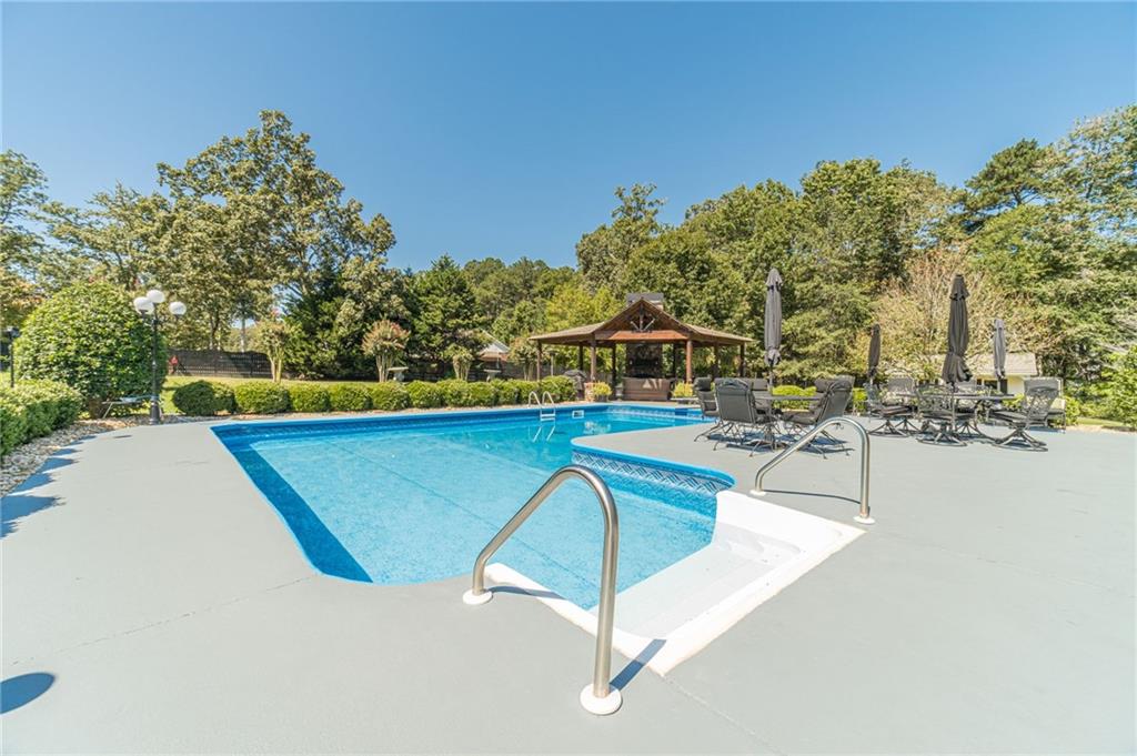1600 Beagle Run Monroe, GA 30656 - Photo 90 of 103 a view of a swimming pool with a patio