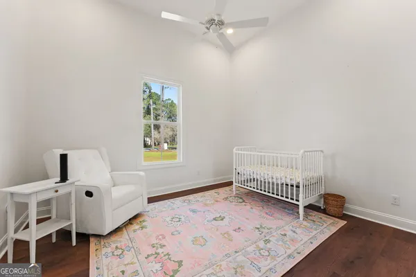a bedroom with furniture and a window