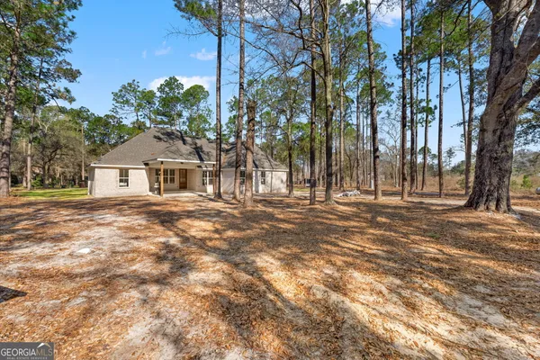 a house with trees in front of it
