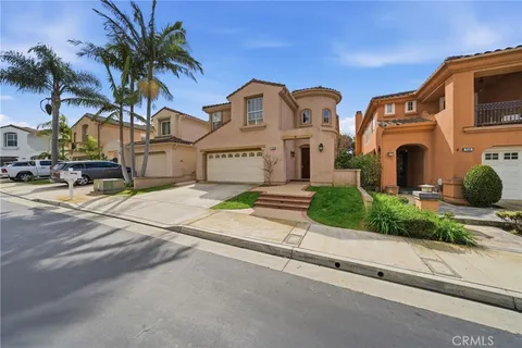 a front view of multiple houses with yard