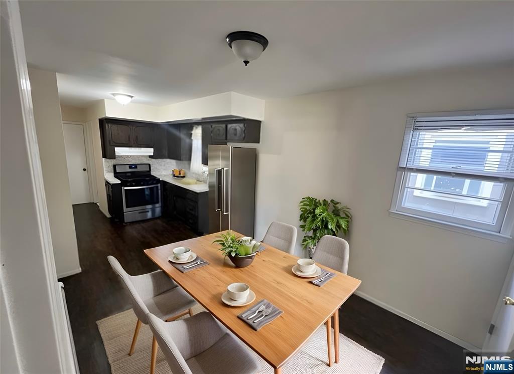316 John Street, Unit 2 Harrison, NJ 07029 - Photo 3 of 7 a view of a dining room with furniture