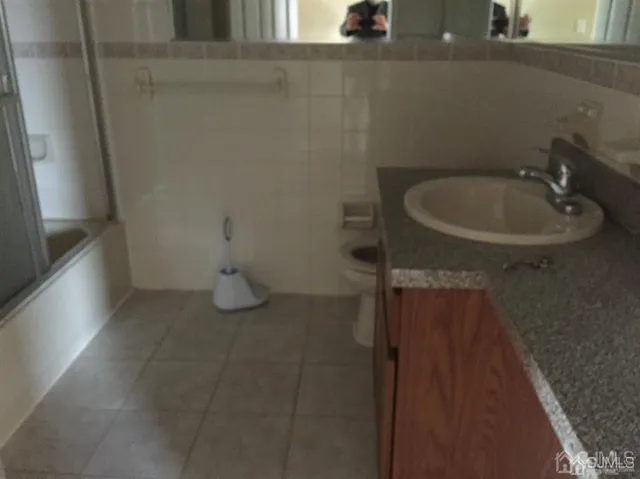 a bathroom with a sink and toilet