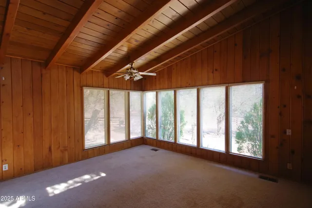 a view of empty room with windows