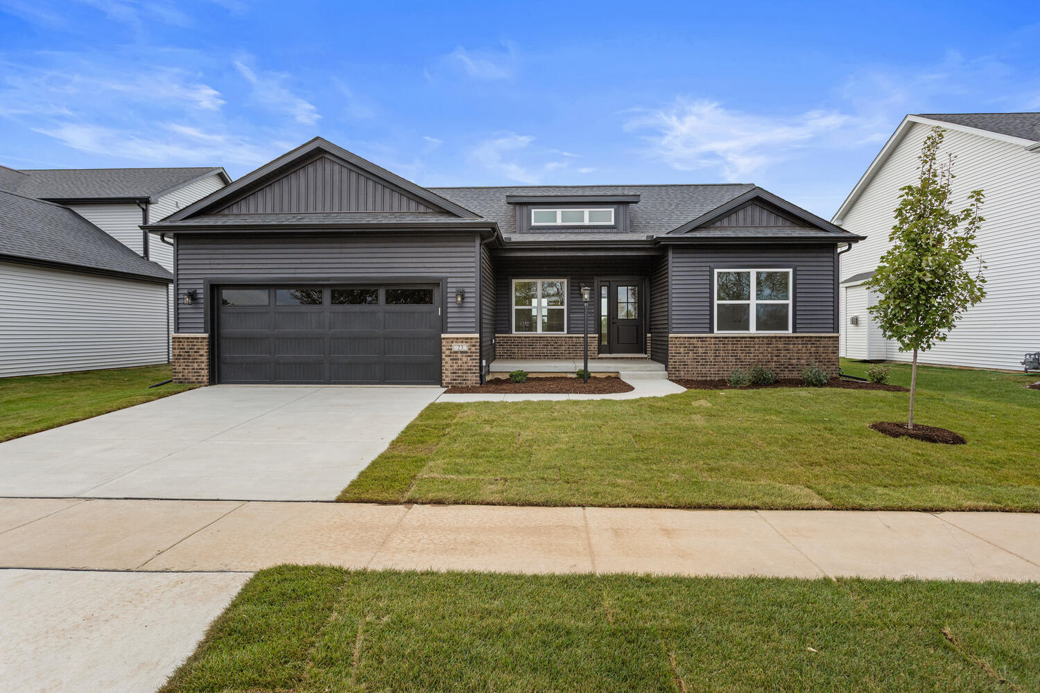 23 Meadow Drive Monticello, IL 61856 - Photo 1 of 1 a front view of a house with a yard and garage