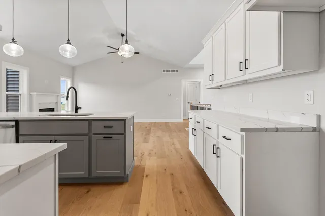 a kitchen with cabinets a sink and dishwasher