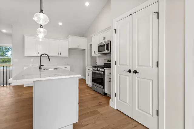 a large kitchen with a lot of counter space and a sink