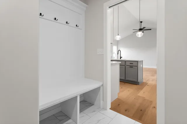 a bathroom with a sink toilet vanity and shower