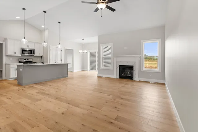 a view of a kitchen with a sink and a fireplace