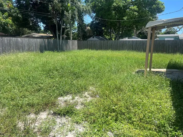 a view of a backyard with a small cabin