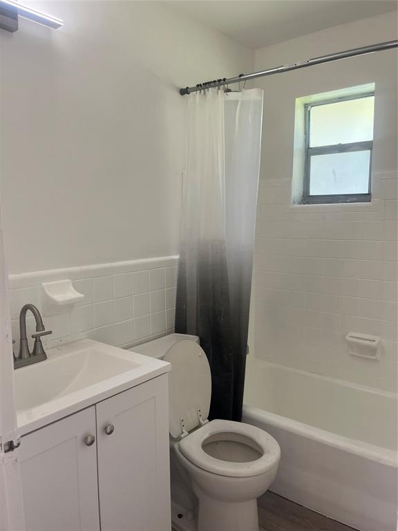 5641 Sheridan Street Hollywood, FL 33021 - Photo 7 of 13 a bathroom with a sink a toilet and shower