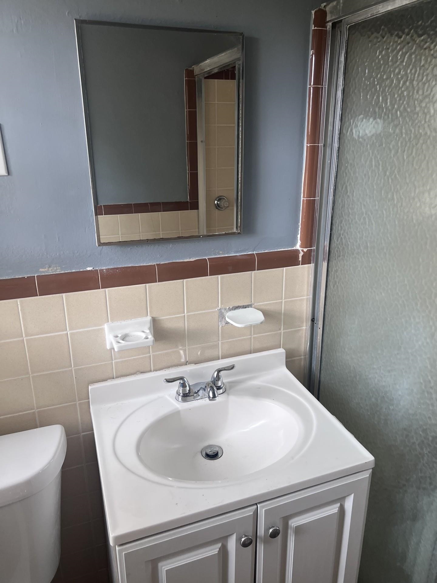 3553 Rhodes Avenue Memphis, TN 38111 - Photo 12 of 14 a bathroom with a sink and a toilet