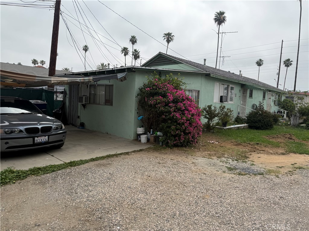 10611 Magnolia Avenue Riverside, CA 92505 - Photo 3 of 5 a view of a car park in front of a house