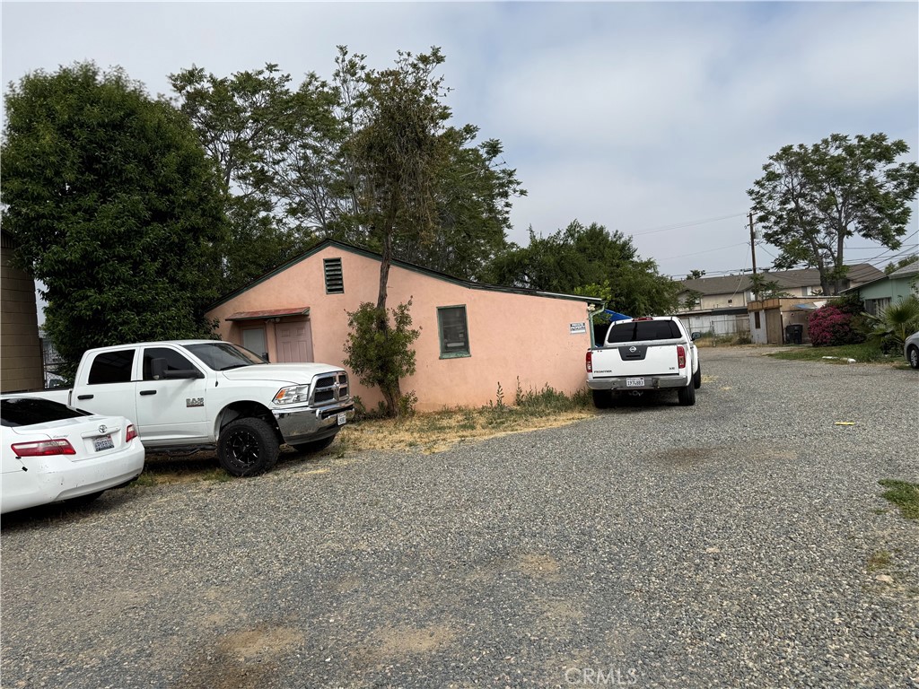 10611 Magnolia Avenue Riverside, CA 92505 - Photo 4 of 5 a view of street with parked cars