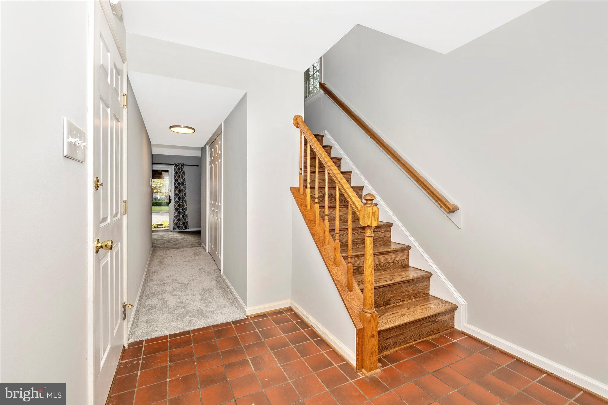8001 Hollow Reed Court Frederick, MD 21701 - Photo 6 of 33 a view of entryway and hall with wooden floor