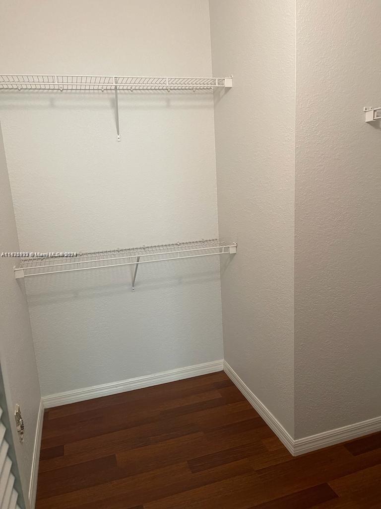 6912 West Sample Road, Unit 6912 Pompano Beach, FL 33063 - Photo 15 of 27 a view of a room with racks on the wall