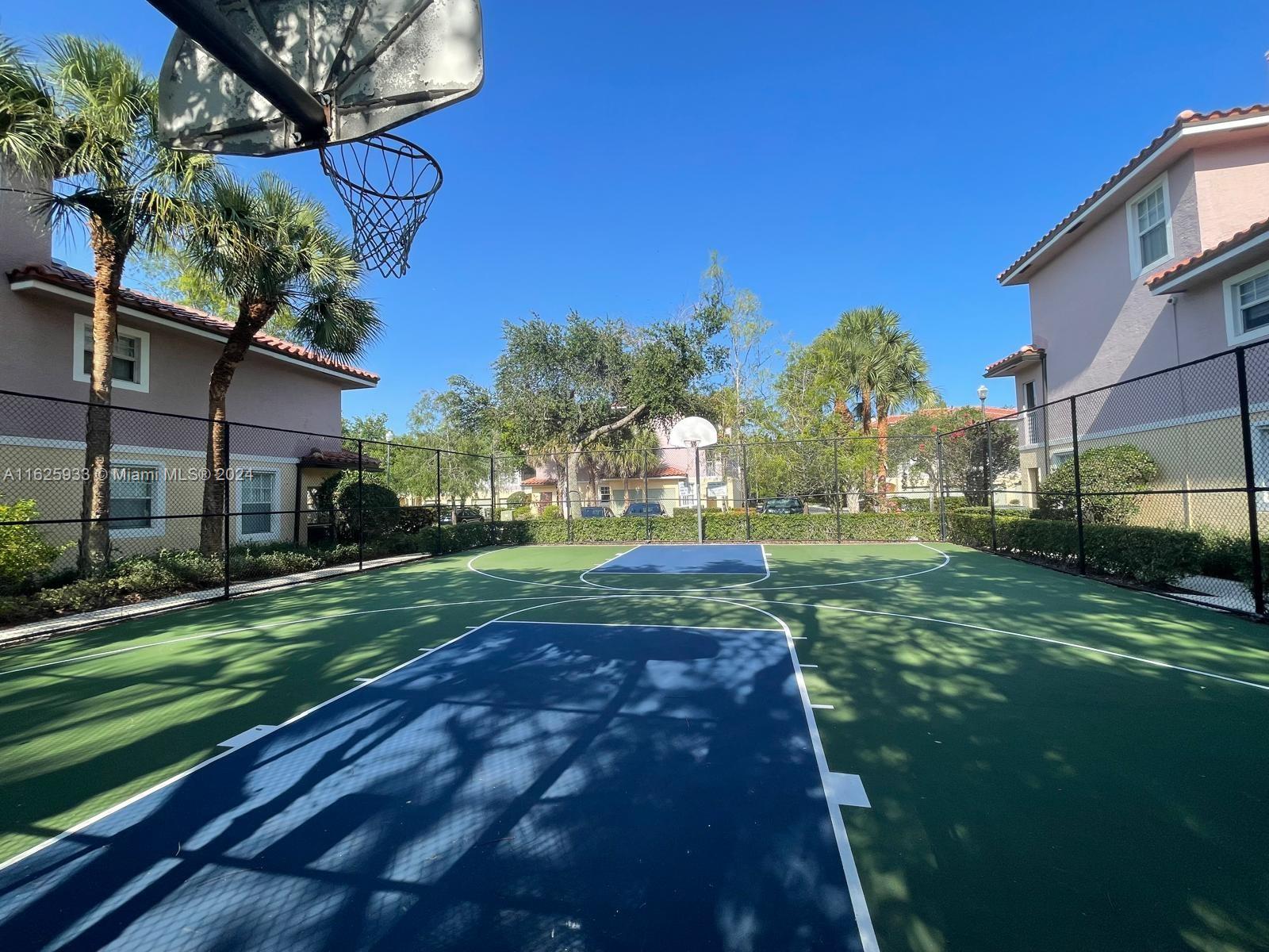 6912 West Sample Road, Unit 6912 Pompano Beach, FL 33063 - Photo 22 of 27 a view of a yard in front of a house