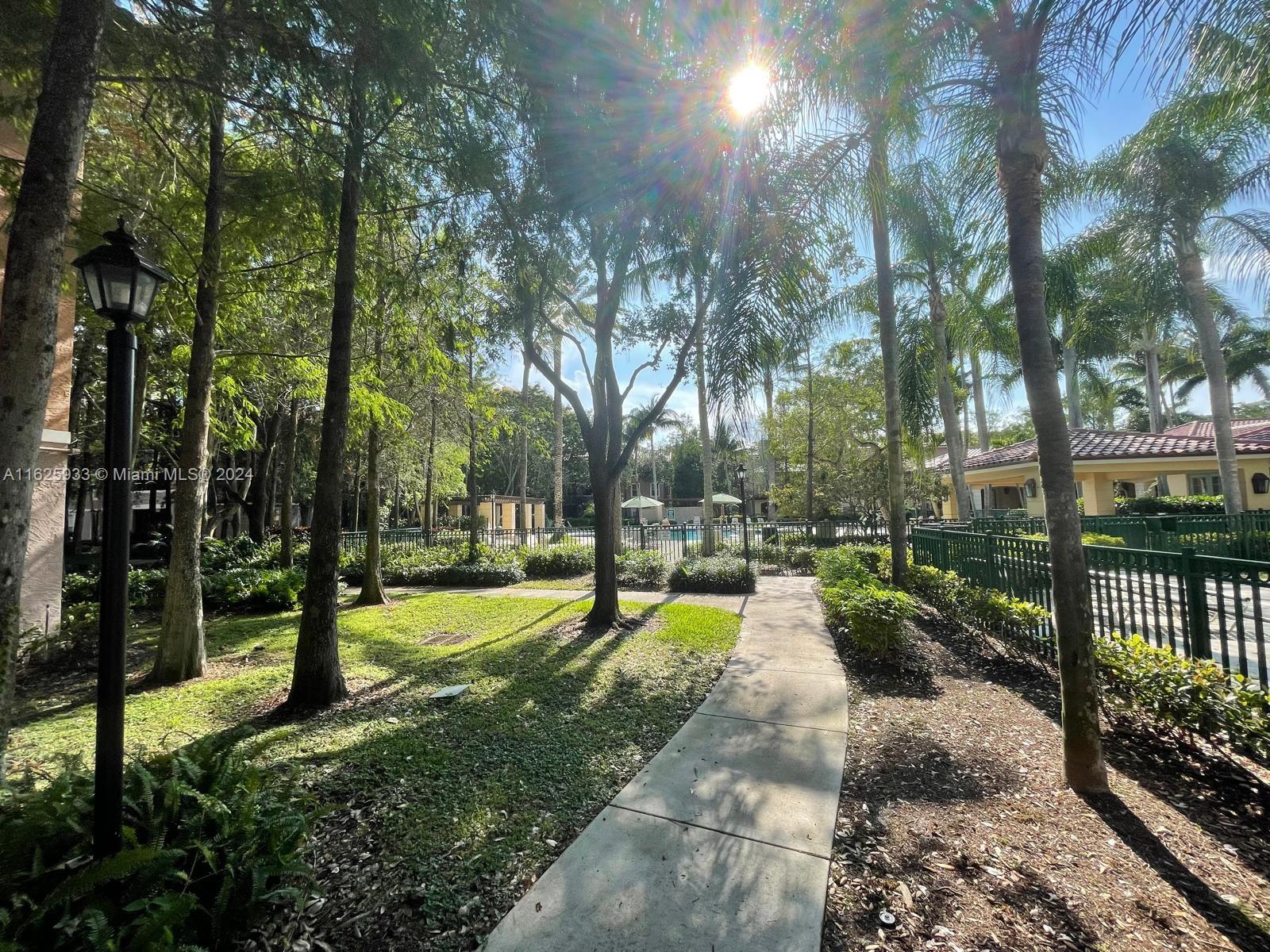 6912 West Sample Road, Unit 6912 Pompano Beach, FL 33063 - Photo 23 of 27 a view of a park with trees