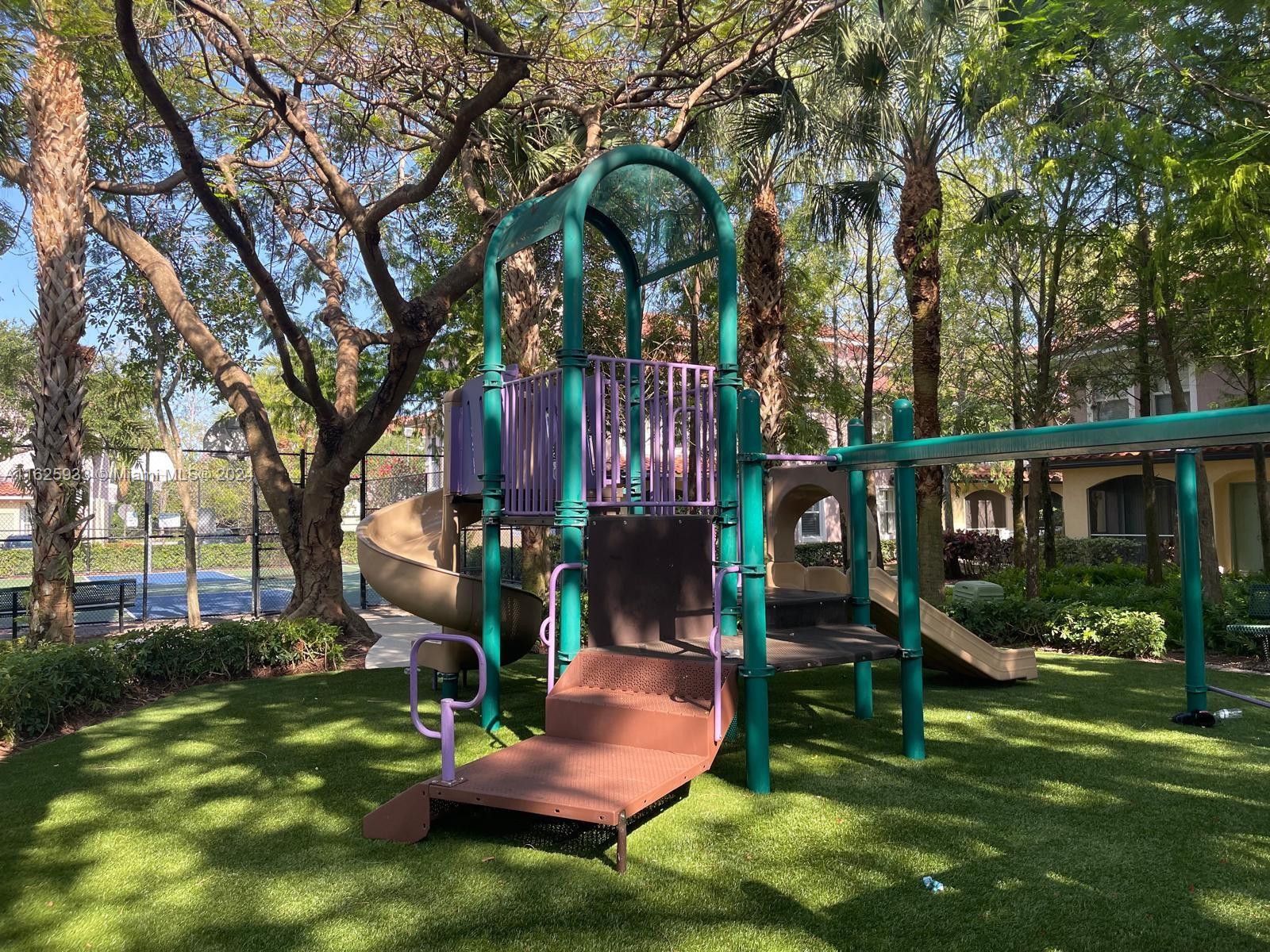6912 West Sample Road, Unit 6912 Pompano Beach, FL 33063 - Photo 5 of 27 a view of a house with backyard and sitting area