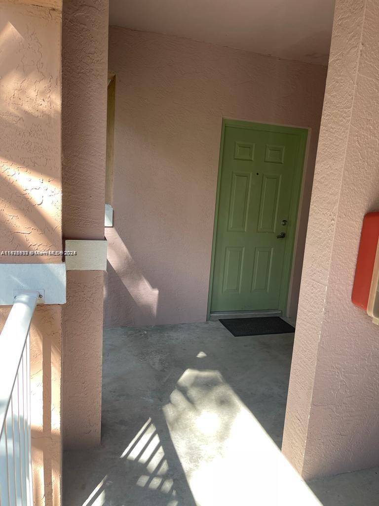 6912 West Sample Road, Unit 6912 Pompano Beach, FL 33063 - Photo 8 of 27 a view of an entryway
