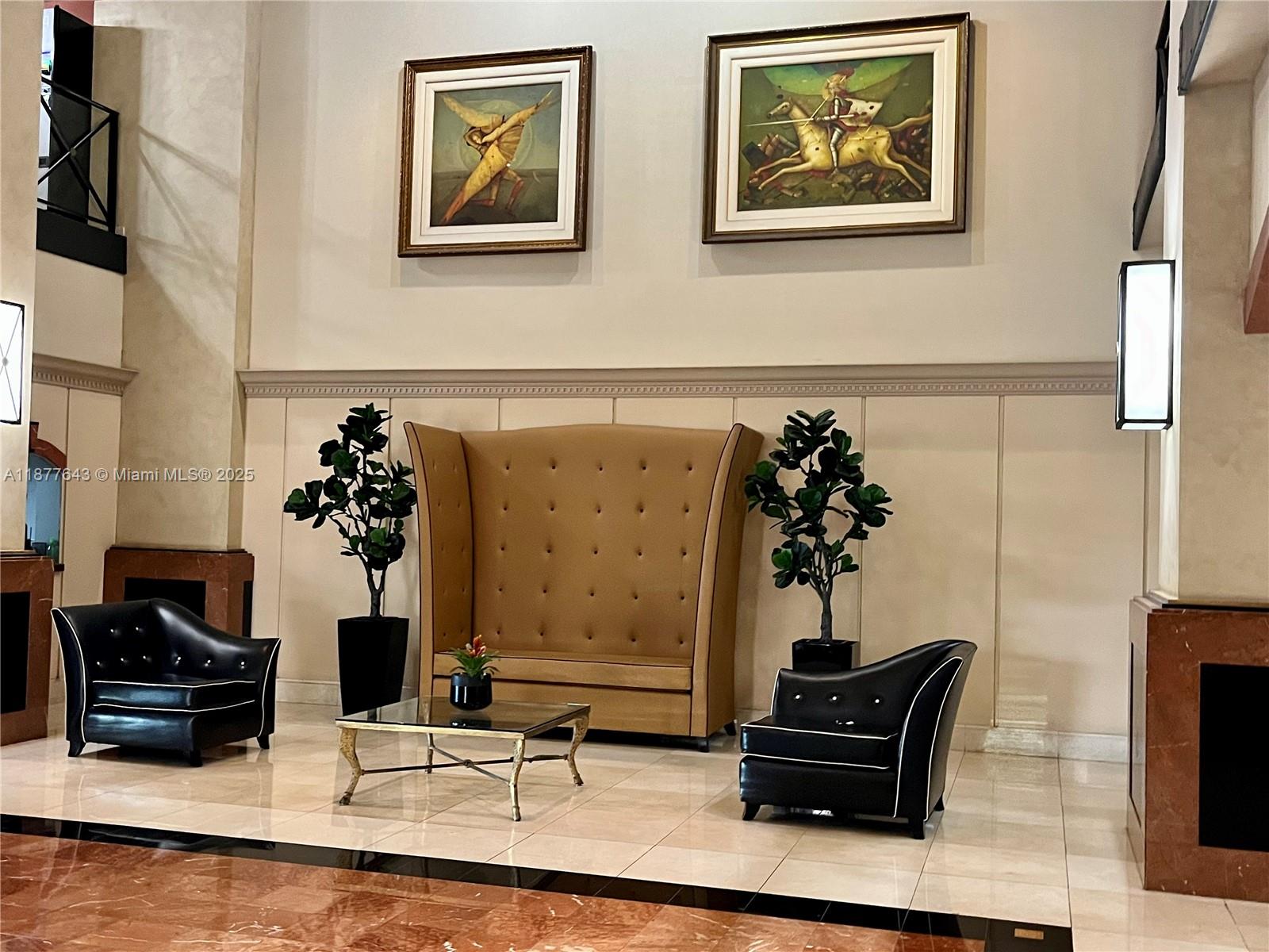 555 Northeast 15th Street, Unit 15G Miami, FL 33132 - Photo 13 of 61 a living room with furniture and flowers