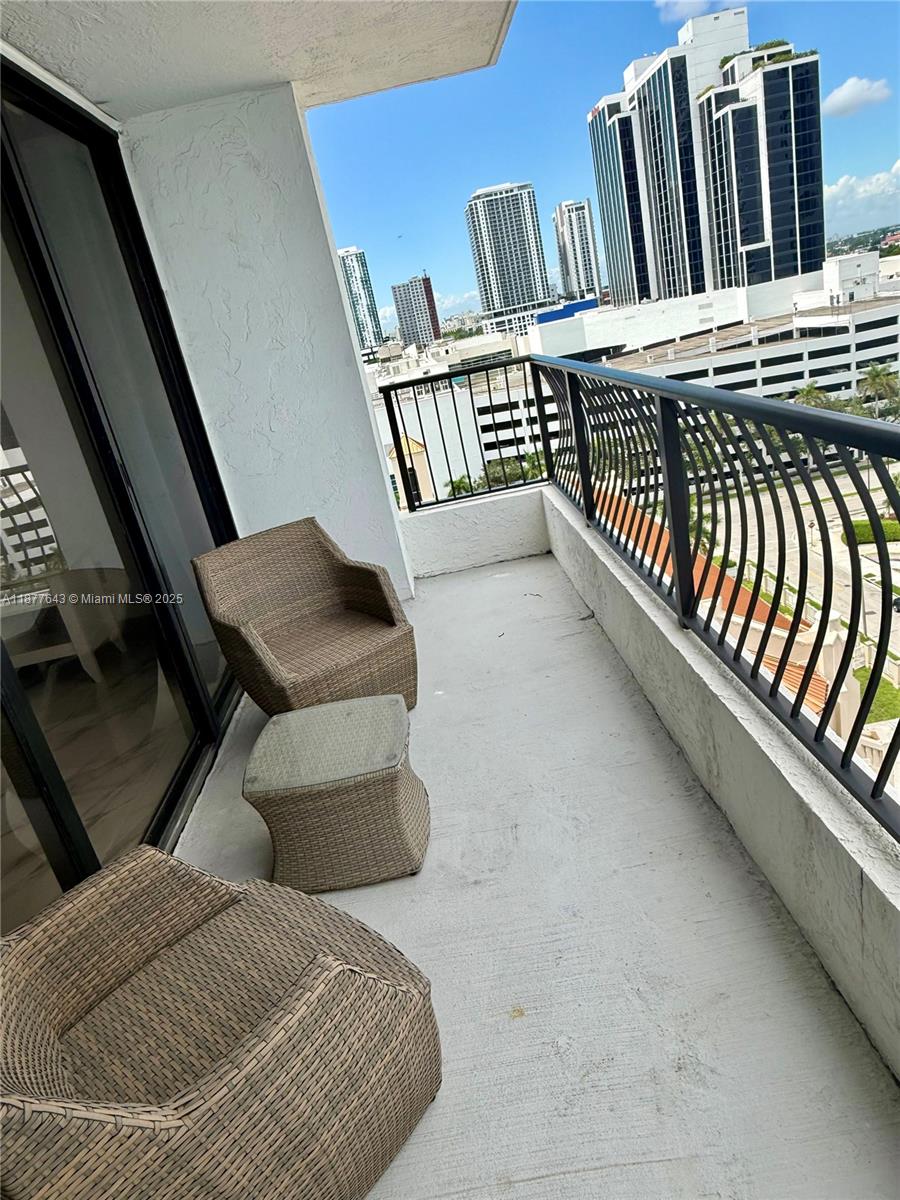 555 Northeast 15th Street, Unit 15G Miami, FL 33132 - Photo 21 of 61 a view of balcony with furniture