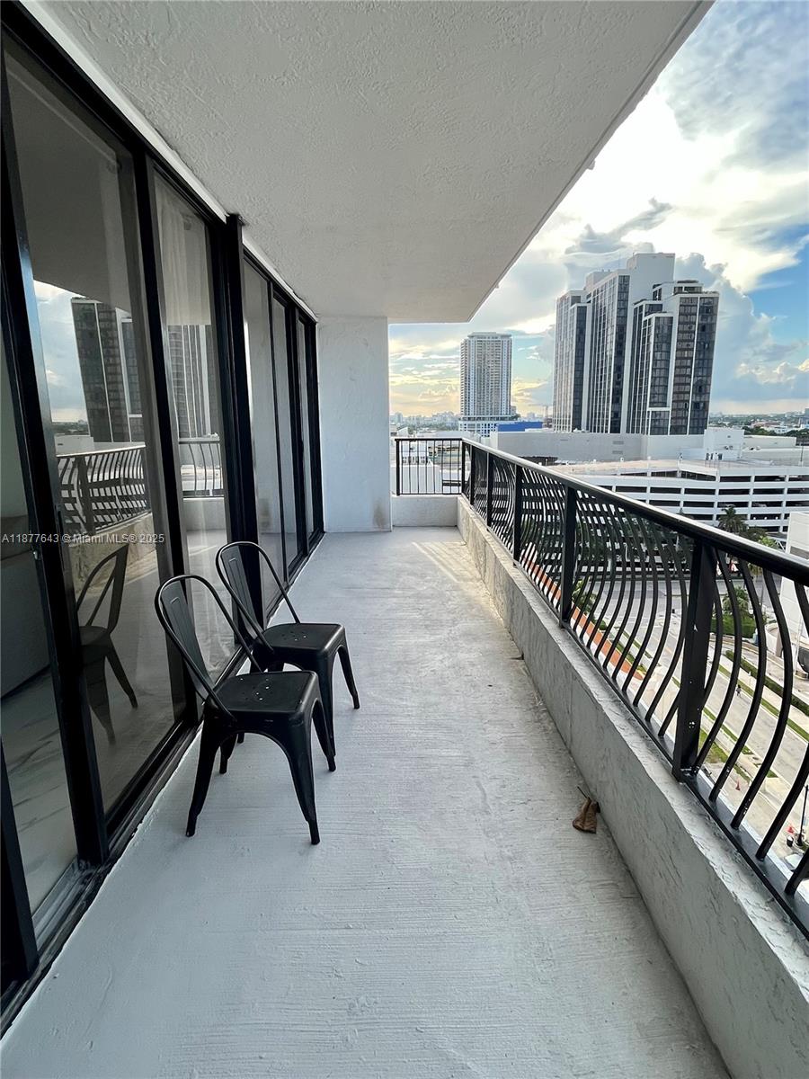 555 Northeast 15th Street, Unit 15G Miami, FL 33132 - Photo 22 of 61 a view of a balcony with chairs