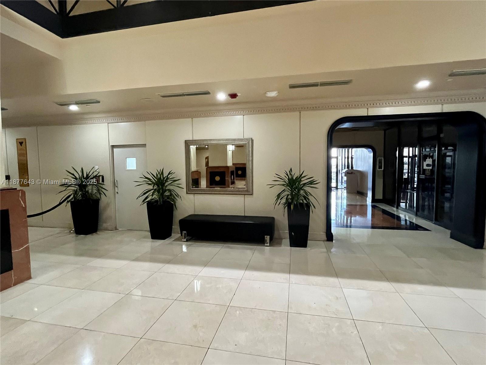 555 Northeast 15th Street, Unit 15G Miami, FL 33132 - Photo 24 of 61 a view of a lobby with furniture and a potted plant