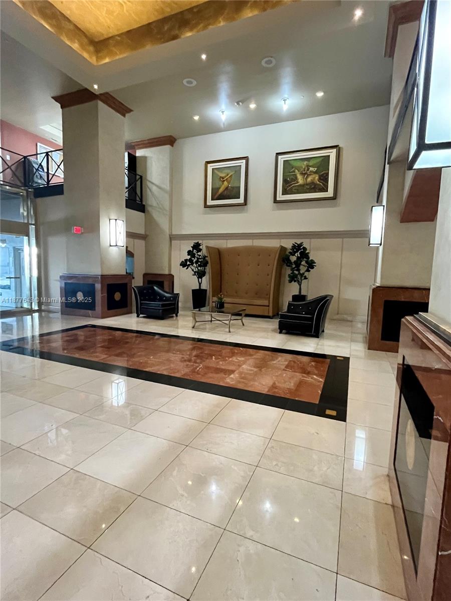 555 Northeast 15th Street, Unit 15G Miami, FL 33132 - Photo 25 of 61 a living room with stainless steel appliances kitchen island granite countertop a rug and a view of living room