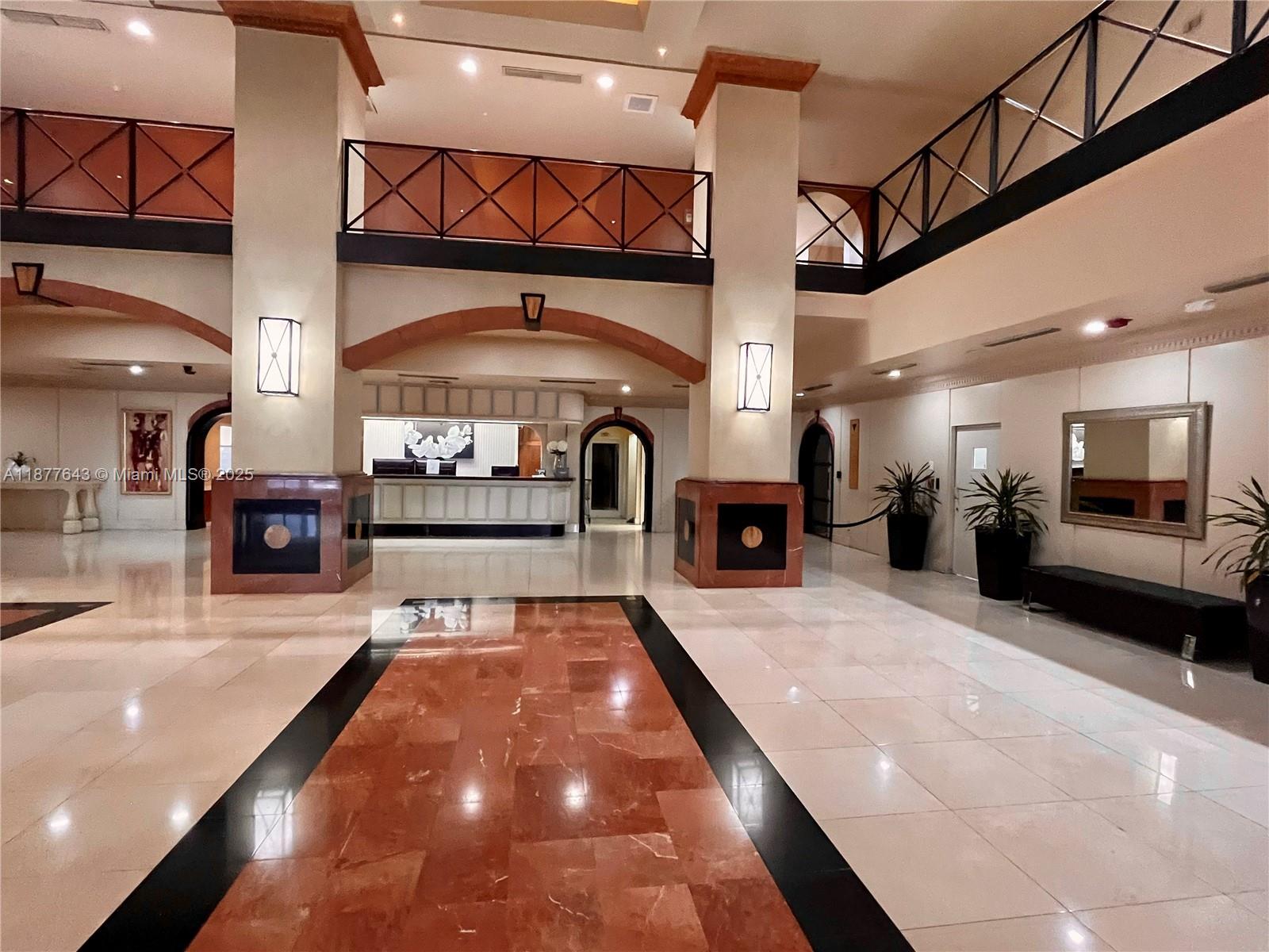 555 Northeast 15th Street, Unit 15G Miami, FL 33132 - Photo 28 of 61 a lobby with furniture and a fireplace