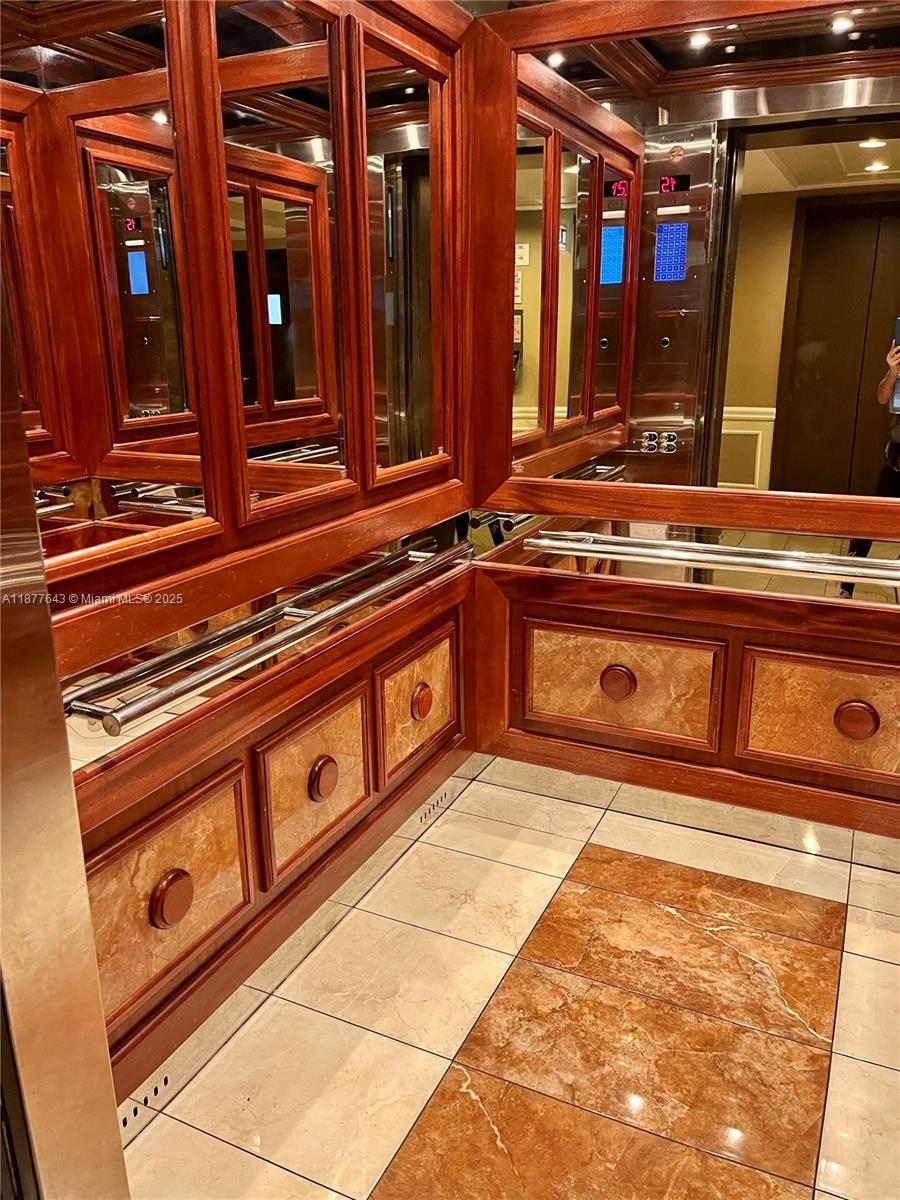 555 Northeast 15th Street, Unit 15G Miami, FL 33132 - Photo 30 of 61 a kitchen with stainless steel appliances granite countertop a stove and a sink