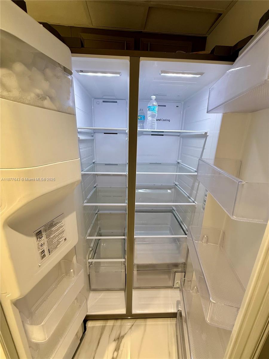 555 Northeast 15th Street, Unit 15G Miami, FL 33132 - Photo 52 of 61 a view of walk in closet with empty racks