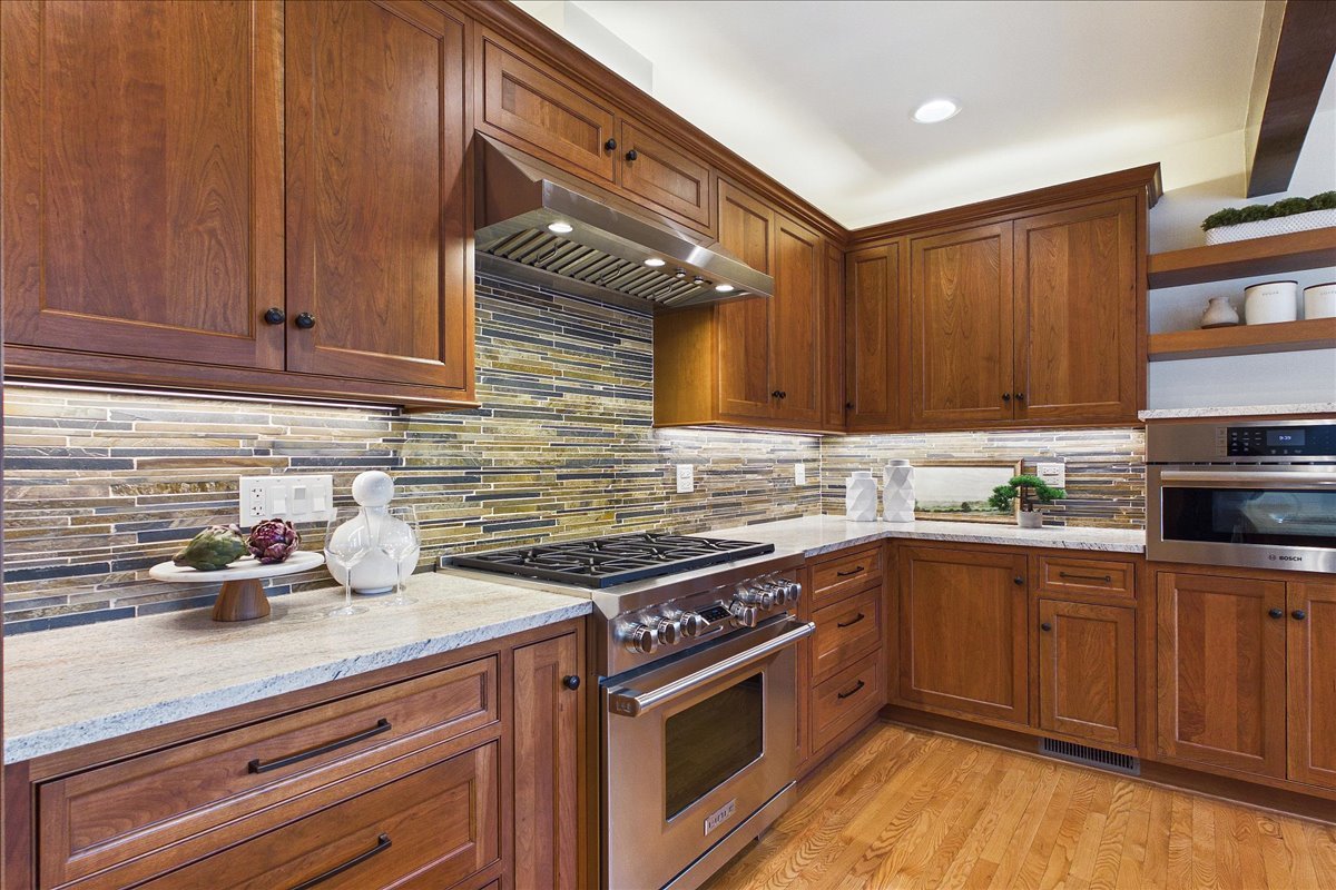 131 West Everett Road Lake Forest, IL 60045 - Photo 11 of 43 a kitchen with stainless steel appliances granite countertop a sink a stove cabinets and wooden floor