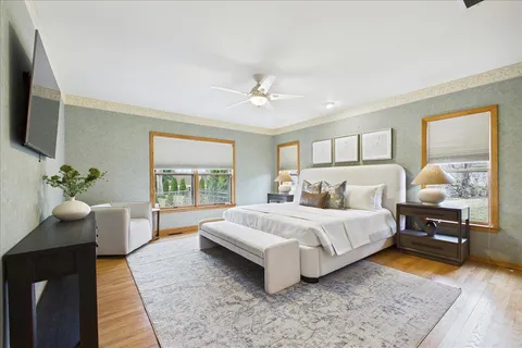 a spacious bedroom with a bed and a couch