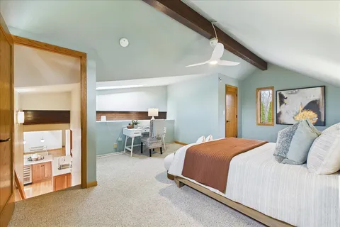 a bedroom with a bed and a cabinets