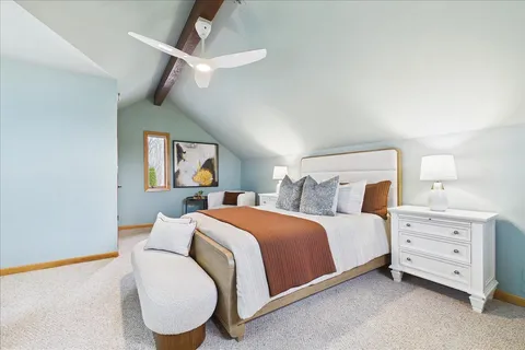 a bed room with a bed and a chandelier