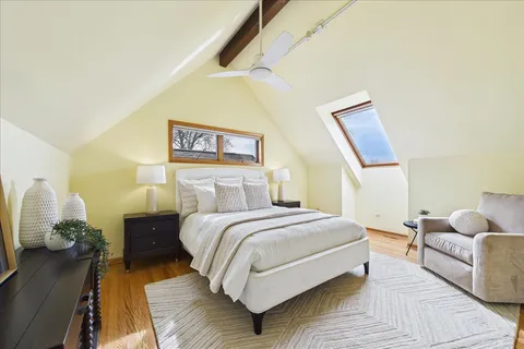 a bedroom with a bed and a couch