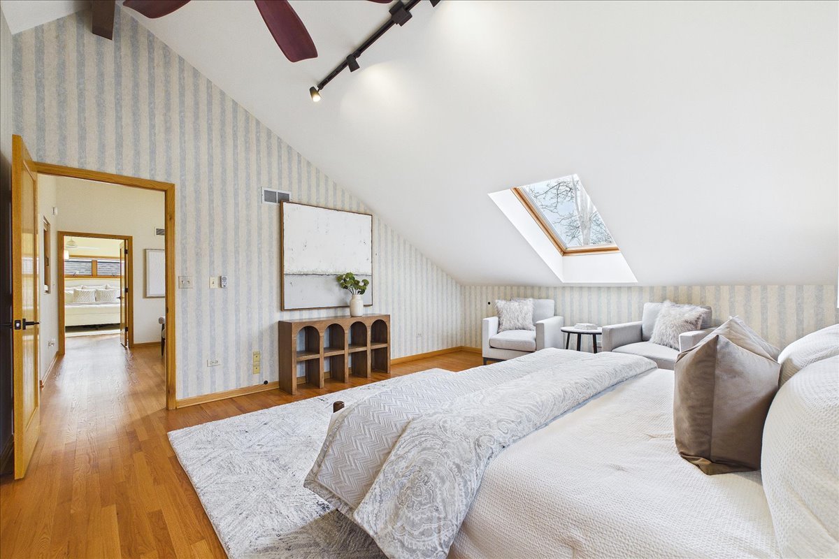 131 West Everett Road Lake Forest, IL 60045 - Photo 30 of 43 a spacious bedroom with a bed and wooden floor