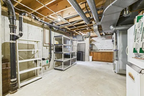 a view of an empty room with a staircase