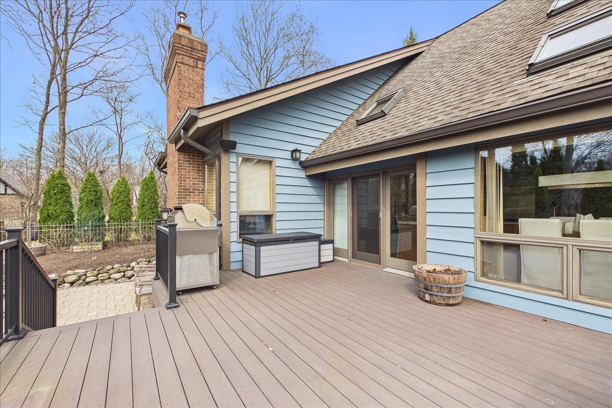 131 West Everett Road Lake Forest, IL 60045 - Photo 40 of 43 a view of a patio with table and chairs with wooden floor and fence