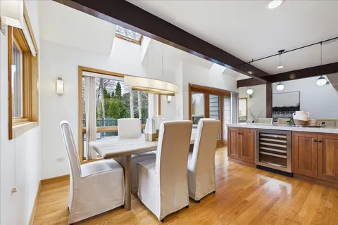 a view of a dining room with furniture window and wooden floor