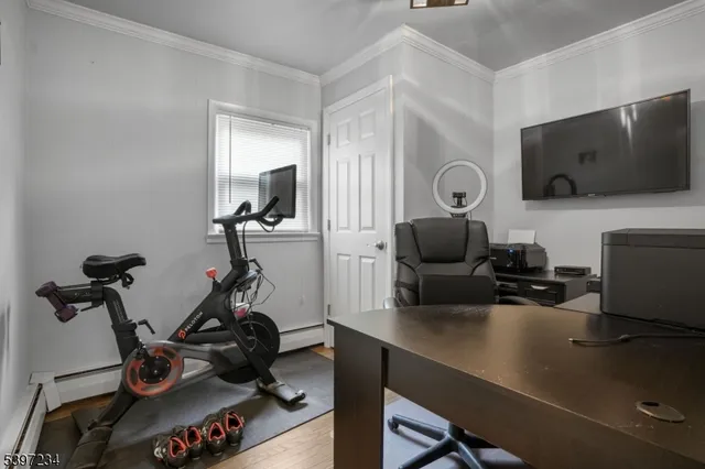 a room with furniture and a flat screen tv