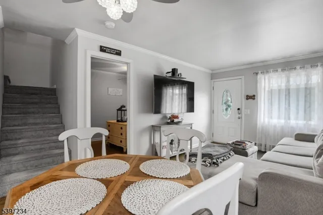 a dining room with furniture and wooden floor