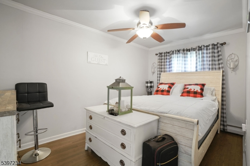 102 East Shore Road Denville, NJ 07834 - Photo 8 of 14 a white bed sitting in a bedroom next to a window