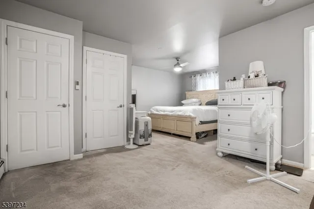 a room with a bed and a night stand