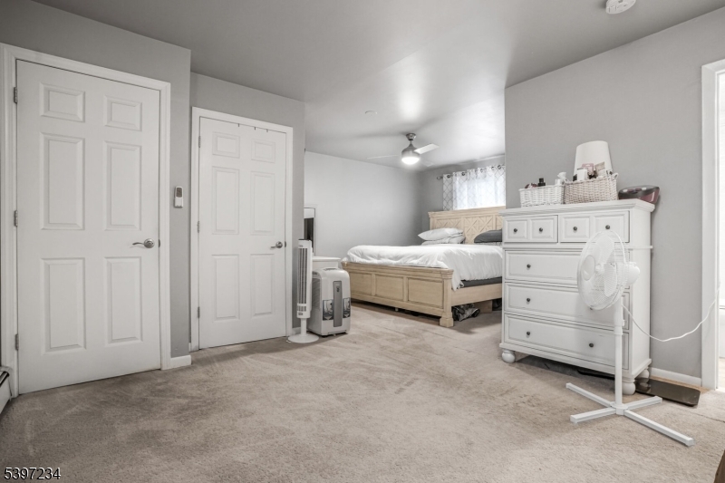 102 East Shore Road Denville, NJ 07834 - Photo 9 of 14 a room with a bed and a night stand