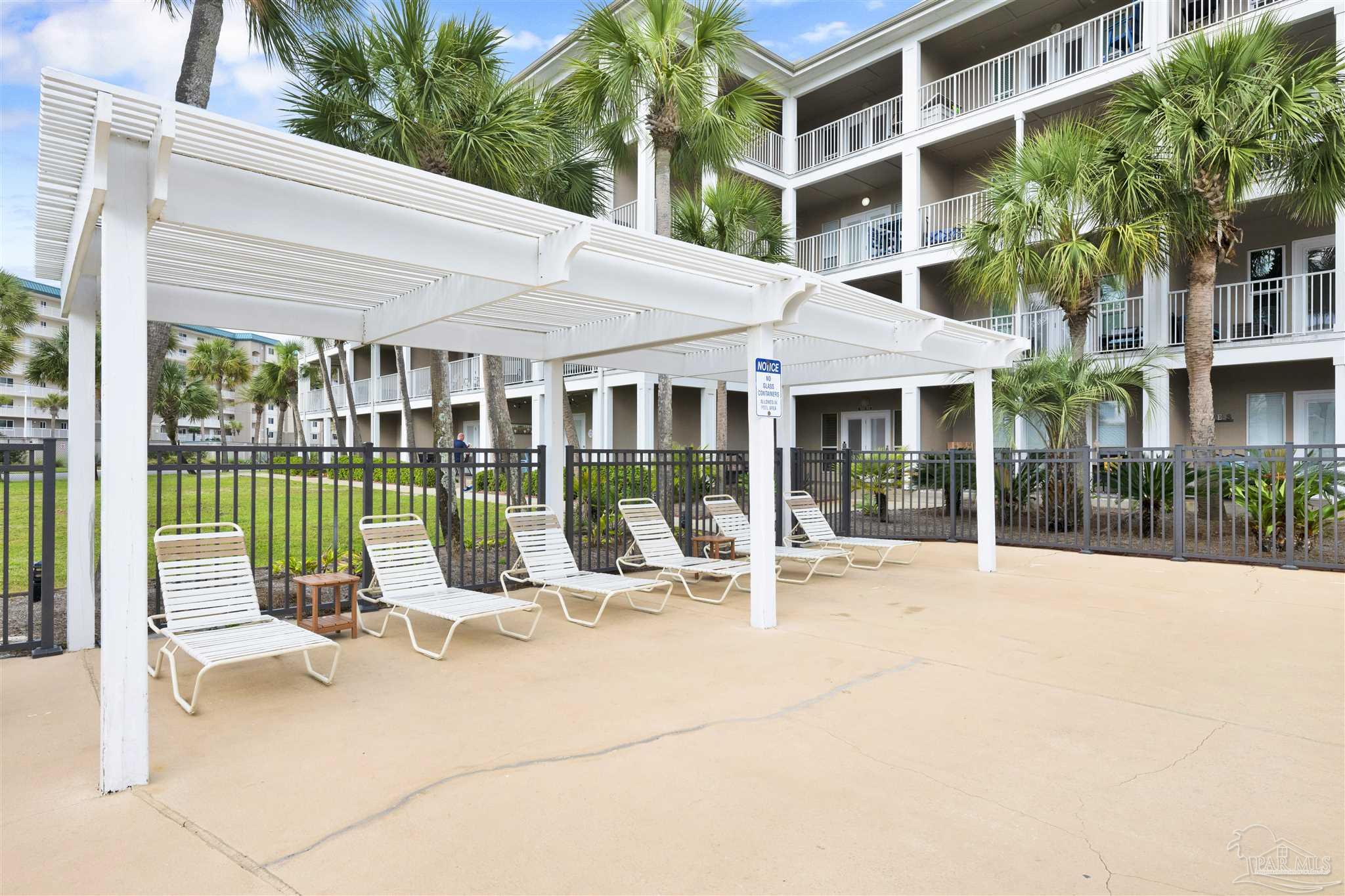 13351 Johnson Beach Road, Unit 203E Perdido Key, FL 32507 - Photo 36 of 55 a building outdoor space with seating space and swimming pool
