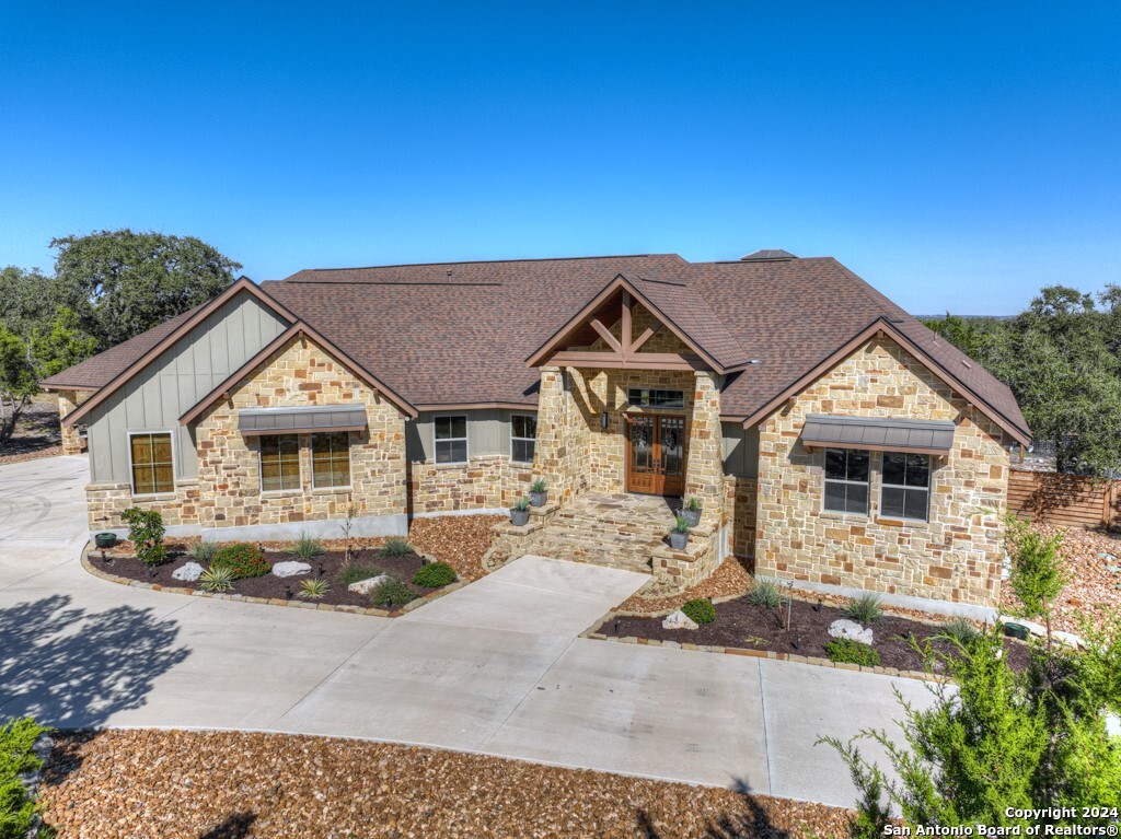 121 Winecup Lane Spring Branch, TX 78070 - Photo 1 of 1 a front view of a house with yard