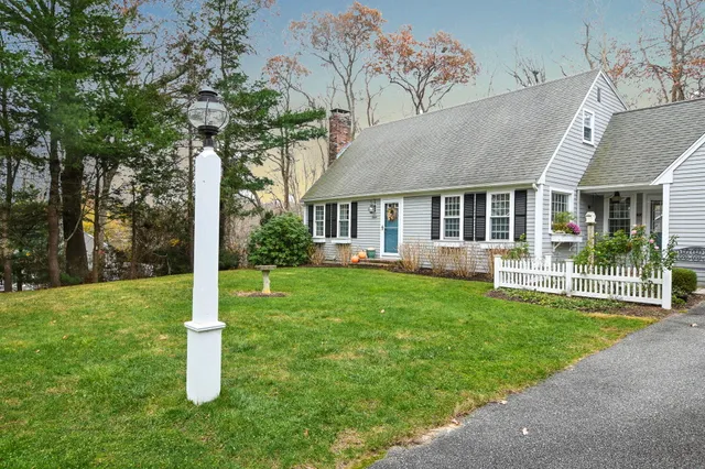 a view of a house with a yard and plants