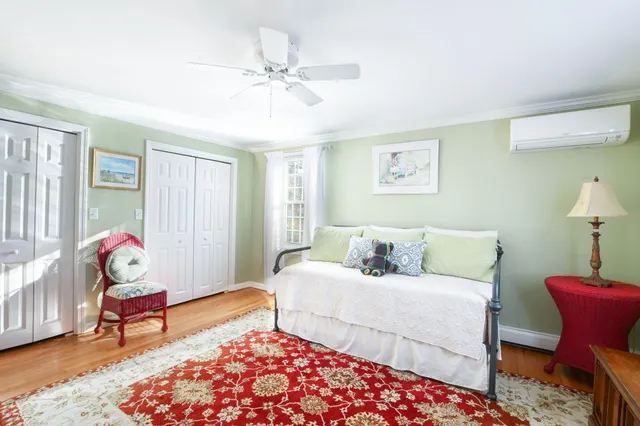 a living room with a couch and a lamp