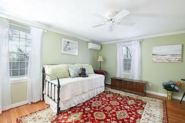 a bedroom with bed and window